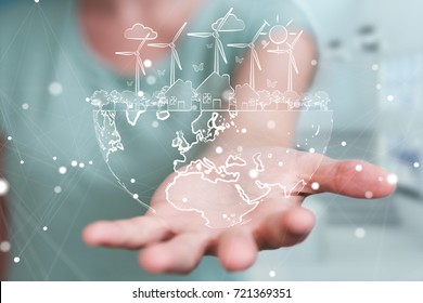 Businesswoman on blurred background touching and holding renewable energy sketch - Shutterstock ID 721369351