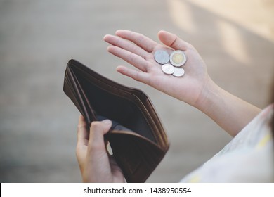 businesswoman on have money unemployed and bankrupt looks into his empty wallet. Stress crisis, unemployed businessmen are waiting for new jobs, recession situation and hopelessness crisis concept. - Shutterstock ID 1438950554