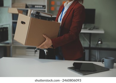 Businesswoman packing her things for move - Powered by Shutterstock