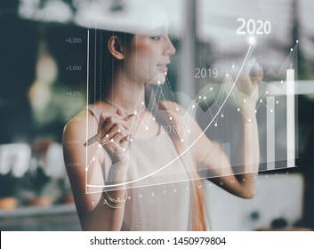 Businesswoman plan growth and increase of positive indicators in his business. Business growth concept year 2020 - Powered by Shutterstock