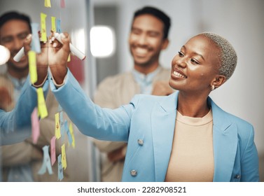 Businesswoman, planning and writing idea in meeting, calendar or agenda, sticky note or innovation. Idea, brainstorming and black woman leader with goal or problem solving, teamwork or solution