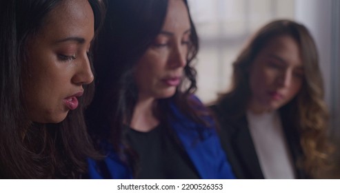 Businesswoman Pointing Screen With Hand Holding Documents And Explaining Work To New Female Employees. Group Of Three People Working Together Collaborating On Job Project