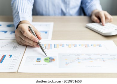 The Businesswoman Points To The Company Financial Summary Prepared By The Finance Department, She Is Checking The Accuracy Of The Monthly Financial Statements. Concept Of Company Financial Management.