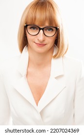 Businesswoman Portrait, White Suit, Sitting And Posing On A Chair 