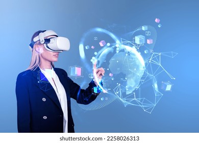 Businesswoman portrait working in vr glasses, finger touch earth sphere hologram hud on blue background. Concept of metaverse and VR