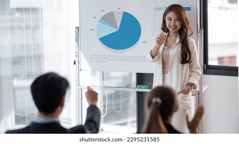 Businesswoman presenting annual reports of the successful business company in meeting room. - Powered by Shutterstock