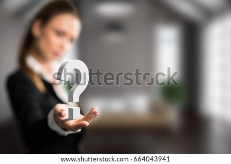 businesswoman presenting a questionmark in front of an apartment scene