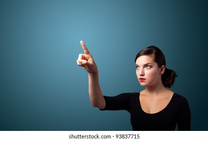 Businesswoman pressing an imaginary button, empty space for buttons - Powered by Shutterstock