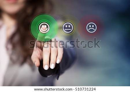 Businesswoman pressing smiley face emoticon on virtual touch screen. Customer service evaluation concept.