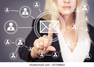 Businesswoman pressing virtual messaging mail sending - Shutterstock ID 257108662