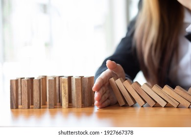  Businesswoman Protect Wooden Block Fall To Planning And Strategy In Risk To Business Alternative And Prevent. Investment Insurance ,Business Risk Control Concept,