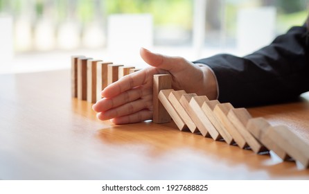  Businesswoman Protect Wooden Block Fall To Planning And Strategy In Risk To Business Alternative And Prevent. Investment Insurance ,Business Risk Control Concept,