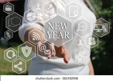 Businesswoman pushing web icon New Year  on virtual screens . Business innovation,business vision , webinar.  