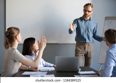 Businesswoman raising hand up at meeting asking presenter team leader, mentor or coach answering questions during seminar or corporate office training, business education and knowledge concept