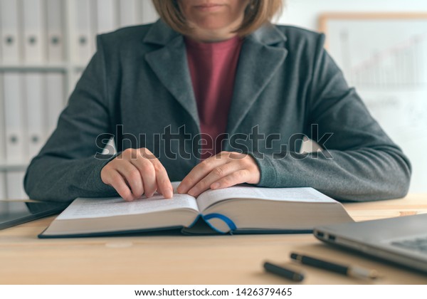 Businesswoman Reading Book Office Desk Searching Stock Photo Edit