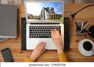 Businesswoman or real estate agent looking through online property portfolio, top view
