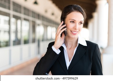 Businesswoman Real Estate Agent Talking On Mobile Phone