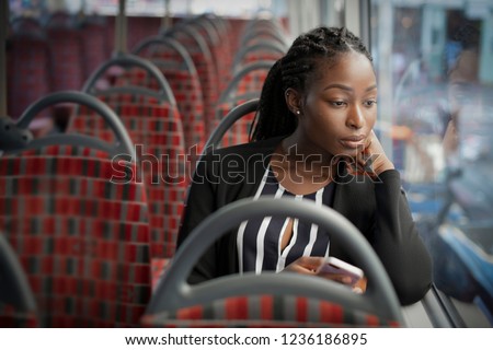 Businesswoman riding the bus to work