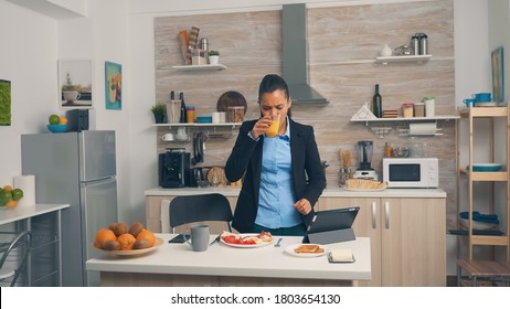 Businesswoman Rushing At The Office During Breakfast. Young Freelancer Working Around The Clock To Meet Her Goals, Stressful Way Of Life, Hurry, Late For Work, Always On The Run