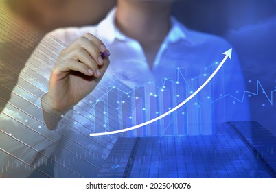 businesswoman set goal analysis chart and graph evolving and growing global economy growth goal setting ideas from a large corporate business valuation. - Shutterstock ID 2025040076
