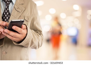 Businesswoman in the shopping mall. - Shutterstock ID 321659453