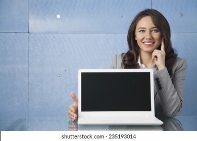 Businesswoman Showing A Laptop Screen