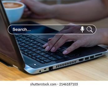 The businesswoman sits at a desk at a workplace,working on a computer laptop. With a blank search bar, the notion is Search engine Browsing Internet Data Information. SEO Networking for Search Engines - Shutterstock ID 2146187103