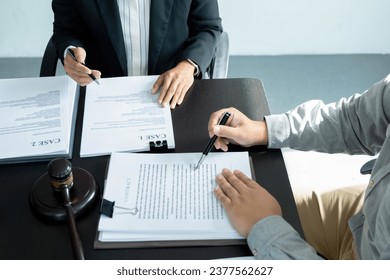 Businesswoman sitting at desk on couch in workplace or at home working on laptop and analyzing data on charts and graphs and writing on papers to make business plan and strategies for company, startup - Shutterstock ID 2377562627