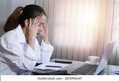 Businesswoman Sitting With Head In Hands At Desk Have Many Papers Work. Office Worker Tired Of Too Much Difficult Unproductive Work. Stressed Female Entrepreneur Has No Idea What To Do With Problem