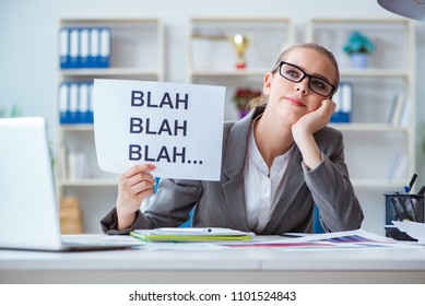 Businesswoman sitting in office with message