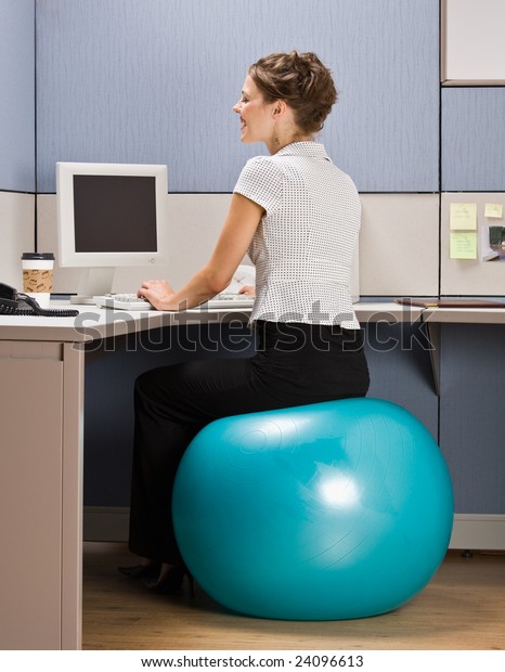 Businesswoman Sitting On Exercise Ball Desk Stock Photo Edit Now