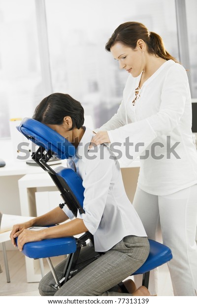 Businesswoman Sitting On Massage Chair Getting Stock Photo (Edit Now ...