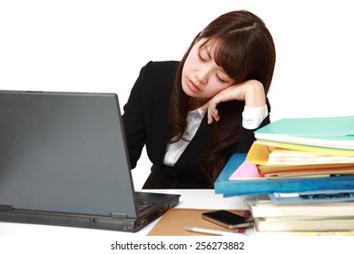 businesswoman sleeping on the desk
