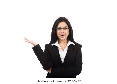 Businesswoman Smile Hold Open Palm With Empty Copy Space, Eye Glasses, Young Attractive Business Woman Wear Black Suit Isolated Over White Background