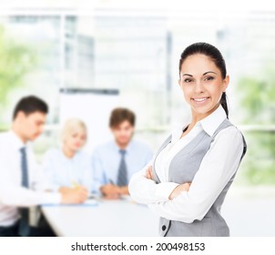 Businesswoman Smile In Modern Bright Office, Business Woman With Colleague On Background