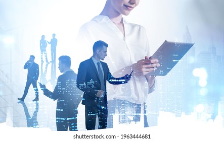 Businesswoman smiling, typing on digital device. Business people with phones, double exposure of office buildings at night. Concept of network in company and technology - Powered by Shutterstock