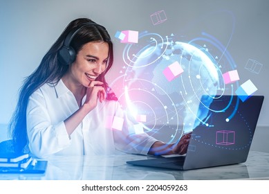 Businesswoman smiling working with laptop, headphones. Double exposure earth globe and circles hologram with colorful big data cubes. Concept of global internet