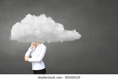 Businesswoman standing with his head in cloud - Shutterstock ID 305450129