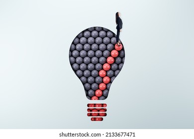 Businesswoman standing on abstract pattern light bulb on light background with mock up place. Idea, growth and success concept
