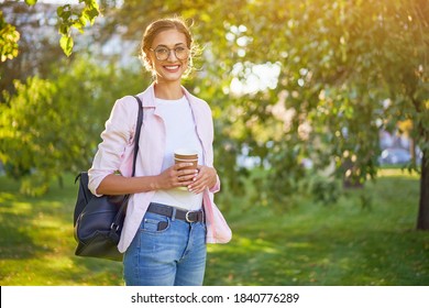 Businesswoman Standing Summer Park Business Person Outdoors Successful European Caucasian Woman Freelancer Or Teacher Walking Outside With Black Backpack Dressed Denim Jeans White Shirt Pink Jacket