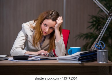 Businesswoman Staying In The Office For Long Hours