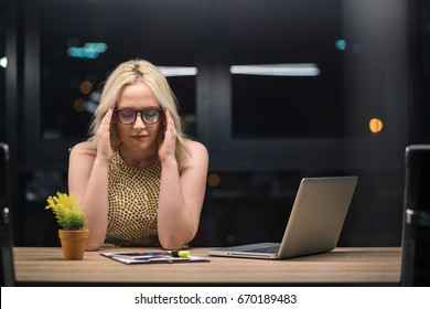 Businesswoman Stressed Working Overtime. Night Shift Worker. 