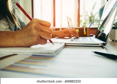 Businesswoman And Successfully People Using Laptop And Writing Notes. 
