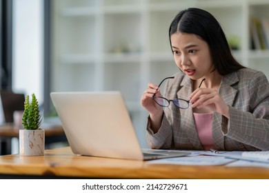 Businesswoman Taking Off Her Glasses Because She Can't Believe Her Eyes Excited To Receive Good News From My Boss Via Email. That She Was Promoted And Get A Big Bonus At The End Of This Year