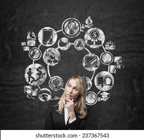 businesswoman thinking and drawing business icon over head