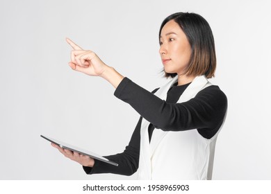 Businesswoman touching invisible screen futuristic technology - Powered by Shutterstock