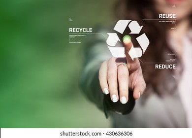 Businesswoman touching recycling symbol on  touch screen. Environmental concept recycle - reduce - reuse. - Shutterstock ID 430636306