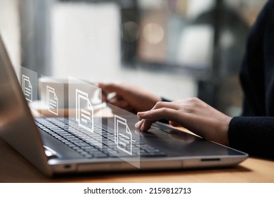 Businesswoman typing on a computer keyboard checking documents Document management concept with icons on ERP virtual screen. Documents, data, icons, check. - Shutterstock ID 2159812713