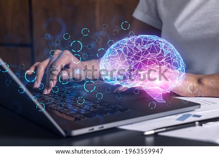 Businesswoman typing on laptop in office. Brain network illustration hologram.