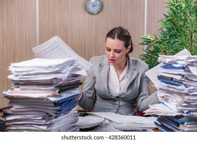 Businesswoman under stress working in the office